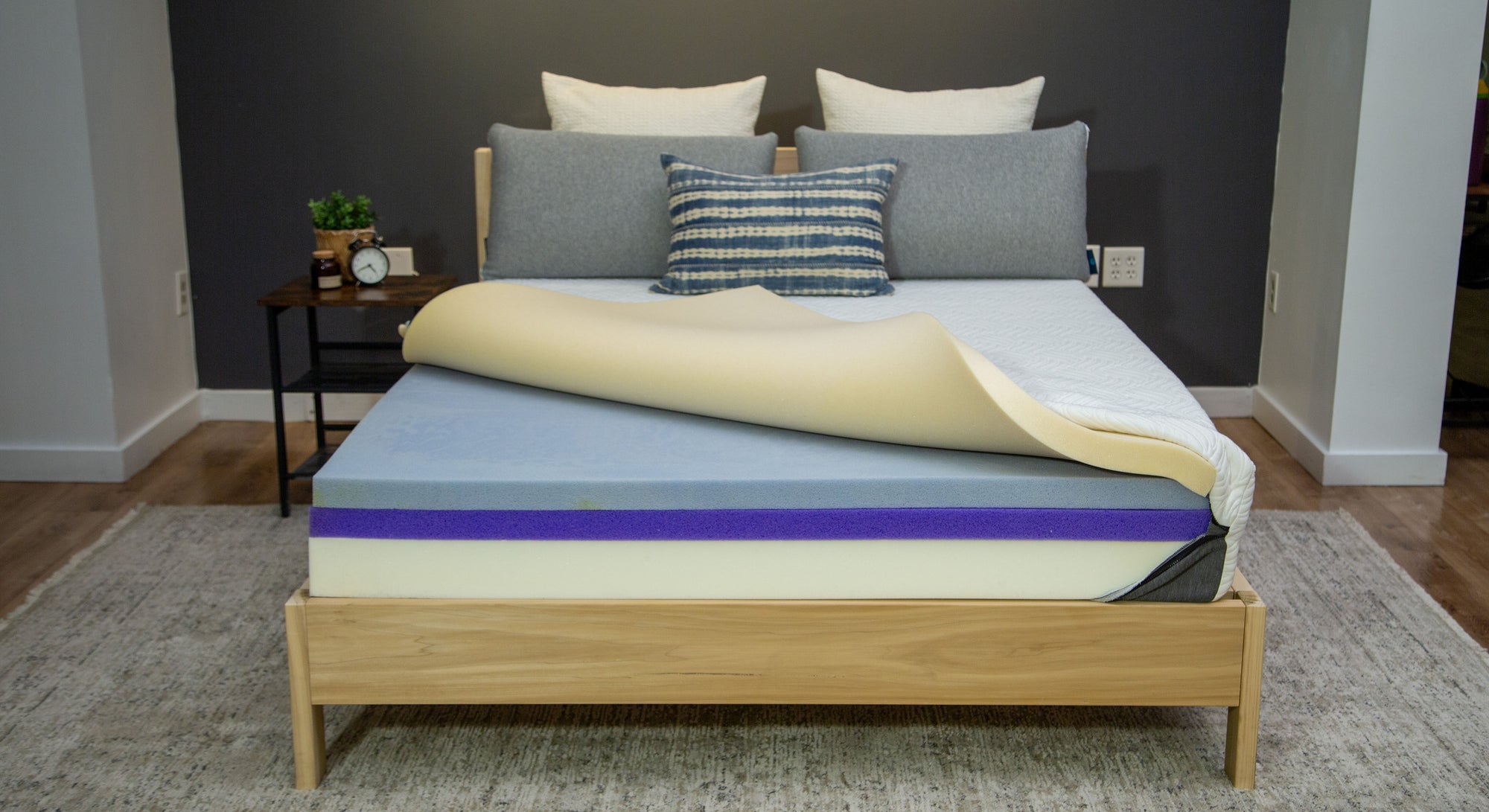 Lifestyle photo of a Comfort Option Custom mattress showing the inside layers
