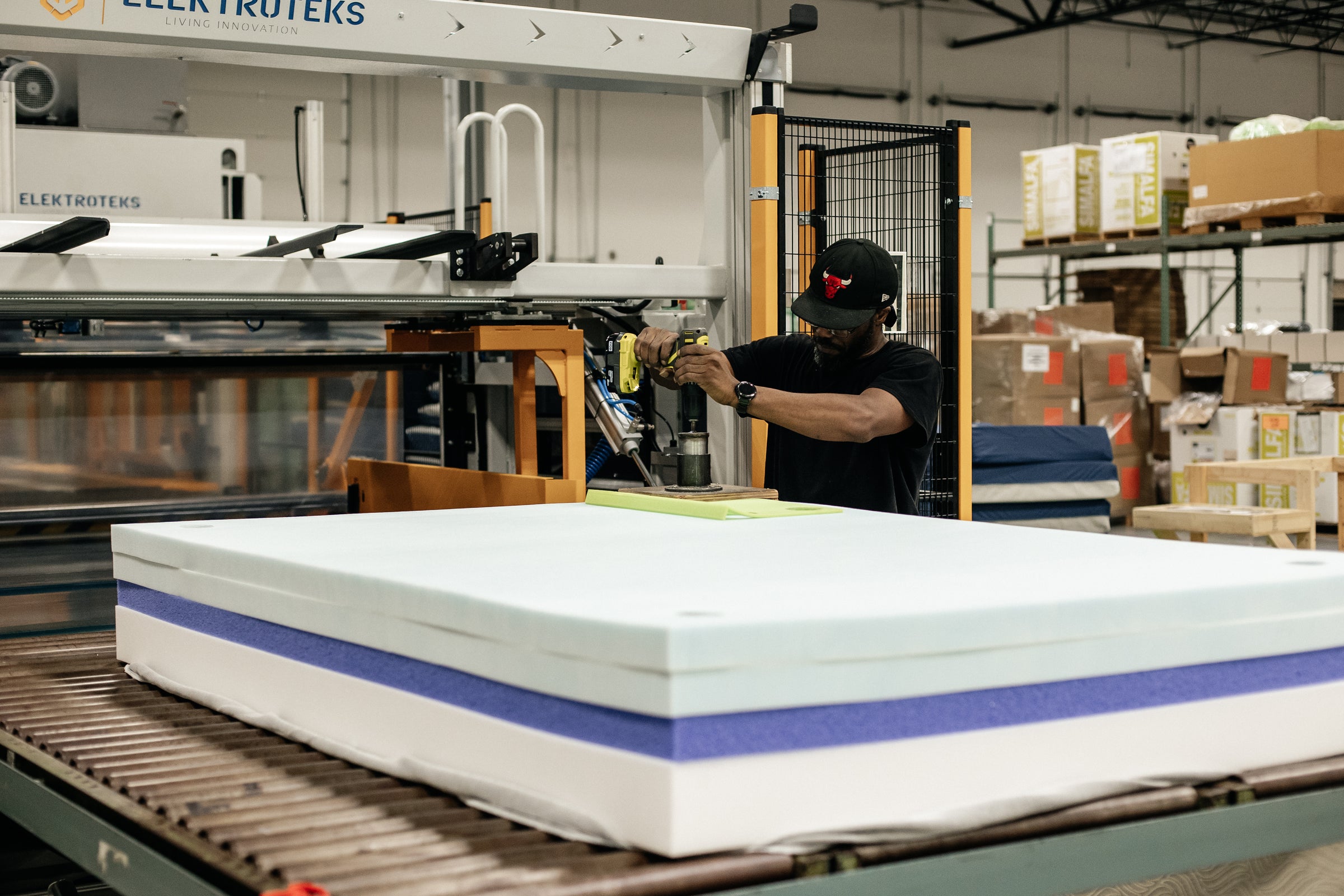 Image of a Comfort Option employee making a mattress
