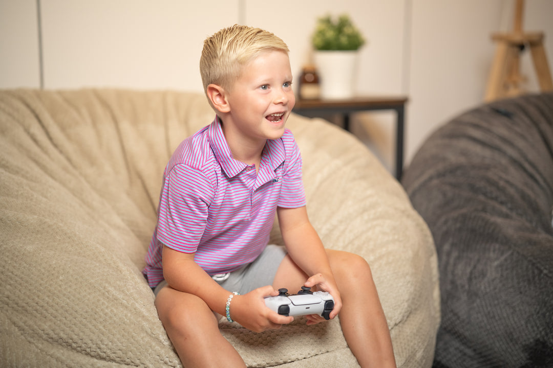 A boy sitting in a Comfort Option Haven Bean Bag