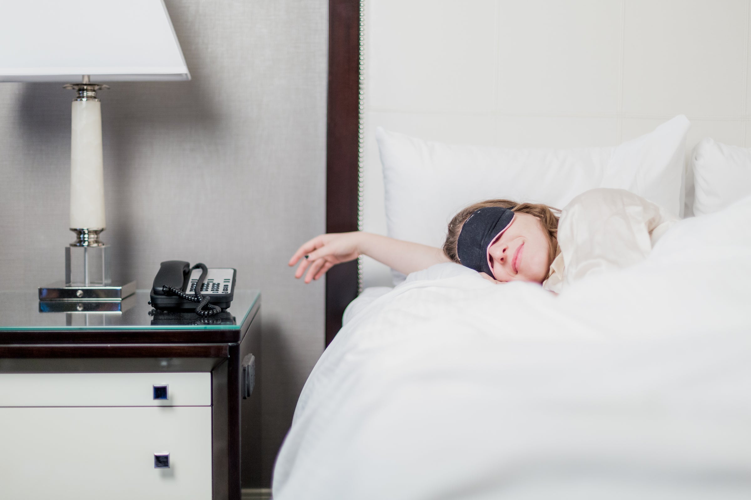 photo of women sleeping in a bed