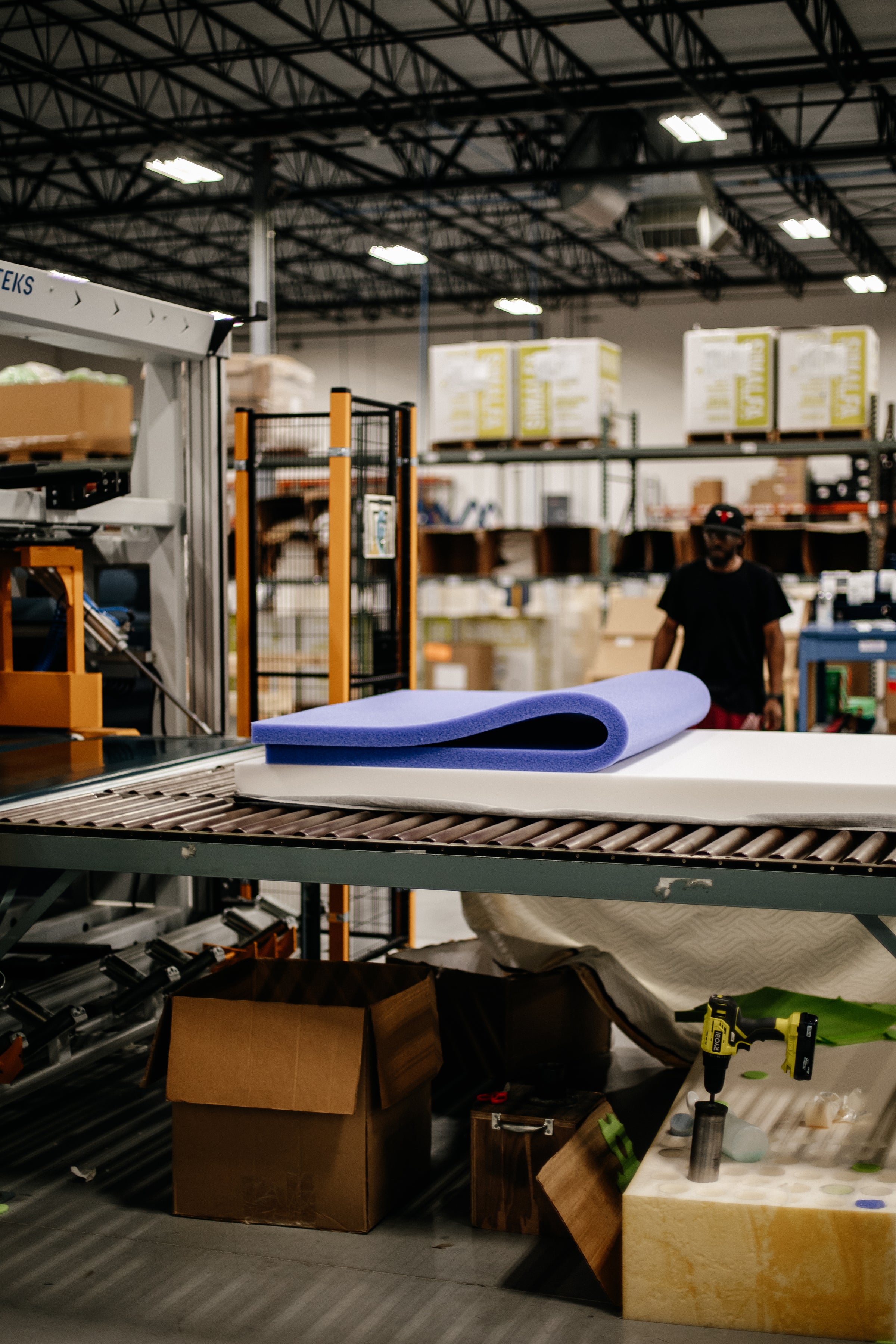 Image of a Comfort Option employee making a mattress