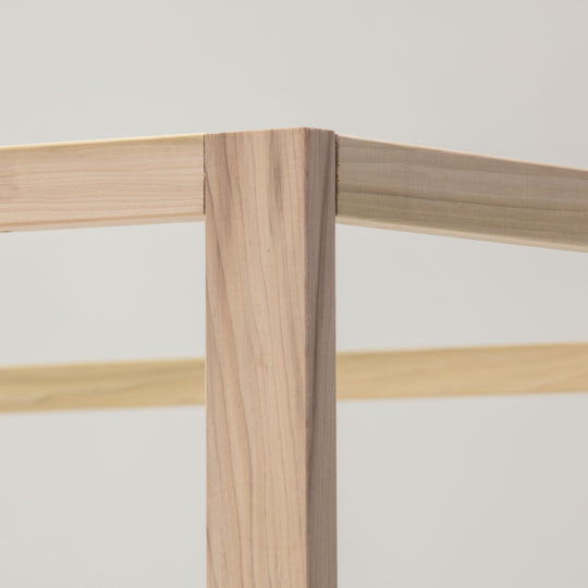 Close-up of a wooden frame with a light background