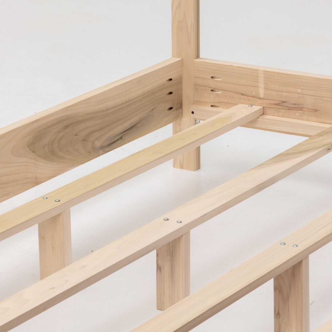 Wooden bed frame on a white background