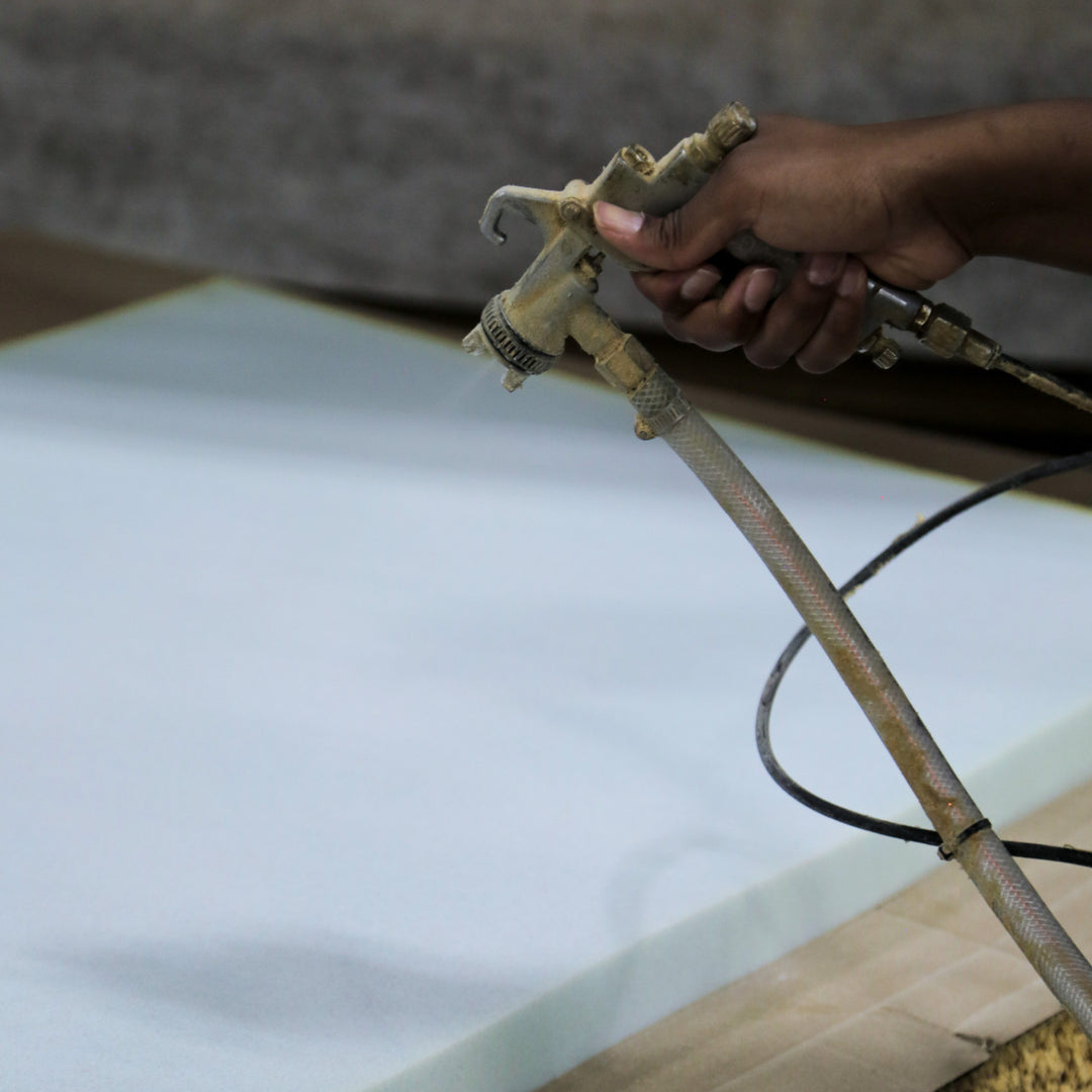 A photo of QulCōte Cooling spray being applied to a foam layer