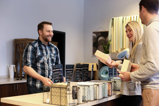 Comfort Option employee interacting with two customers