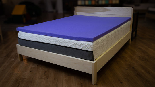 Lifestyle photo of vervaire mattress topper on a mattress