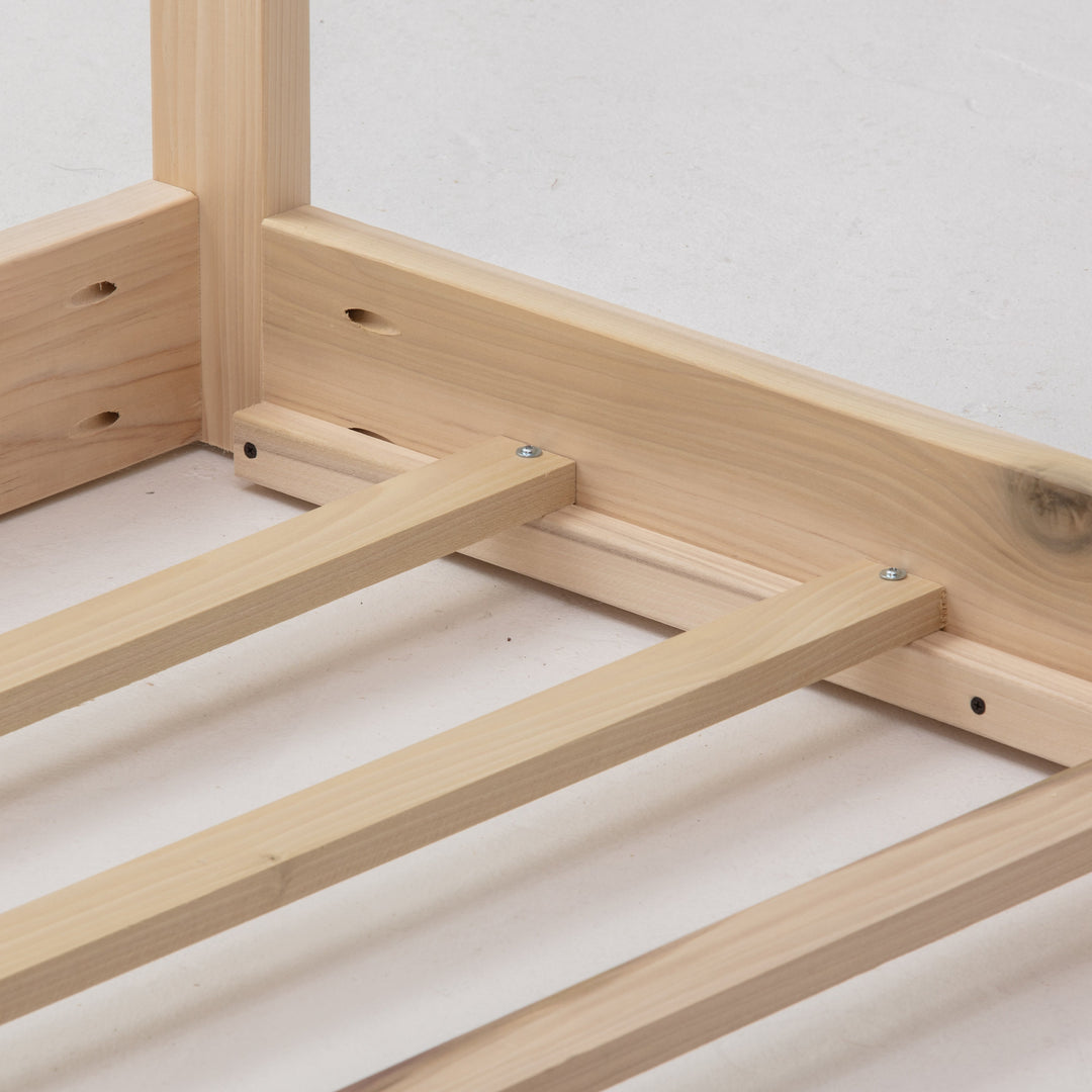 Wooden bed frame on a white background