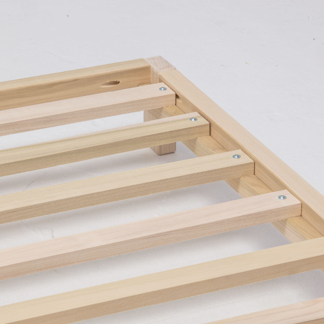 Wooden bed frame on a white background