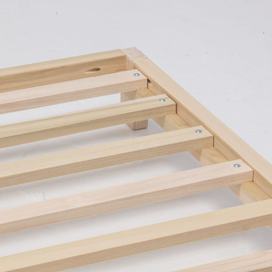 Wooden bed frame on a white background