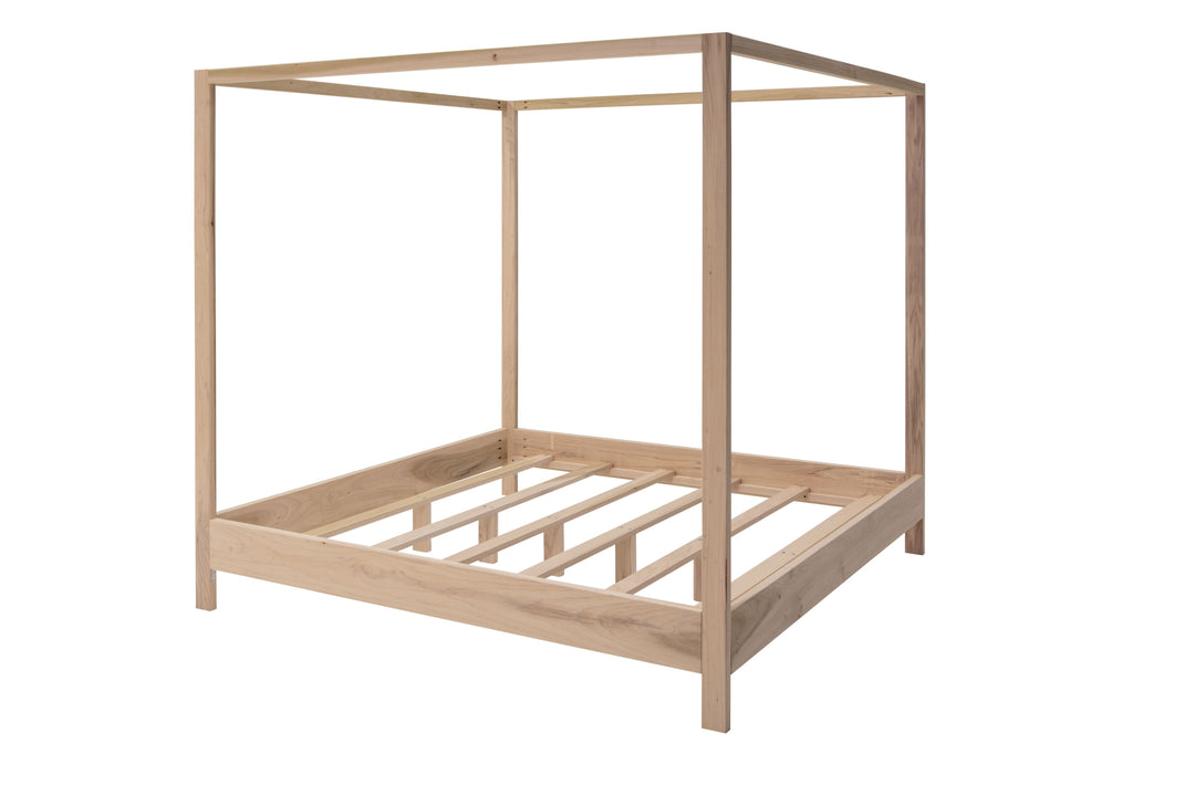 Wooden canopy bed frame on a white background