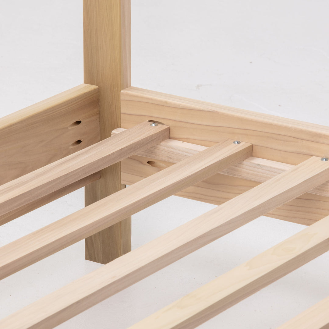 Wooden bed frame on a white background