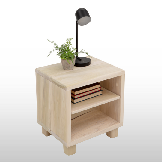 Wooden side table with a lamp, books, and plant on a white background