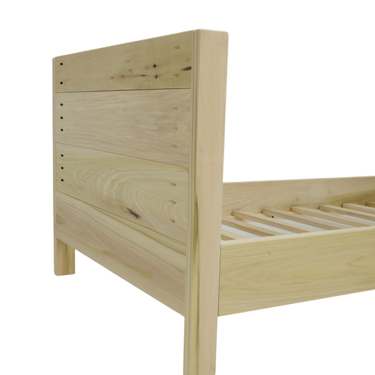 Wooden bed frame on a white background