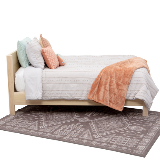 Bed with colorful bedding on a white background